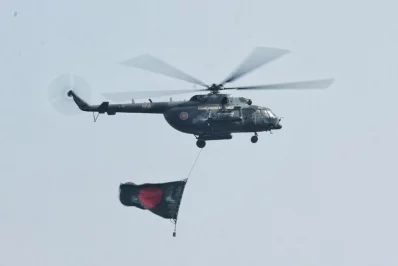 A Bangladesh Armed Forces helicopter waving the Bangladeshi flag to celebrate the Victory Day | Rajib Dhar/Dhaka Tribune