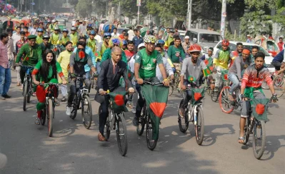 Former vice-chancellor (VC) of Dhaka University AAMS Arefin Siddique leading a rally of cyclers from the Central Shaheed Minar to mark the Victory Day | Focus Bangla