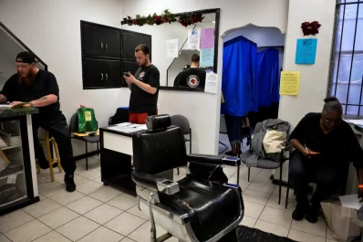 Voters cast their ballots at a polling place inside a barber shop in Philadelphia. Photo: Charles Mostoller