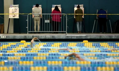 People vote on the deck of the Echo Park Deep Pool during the primary election in Los Angeles, California. Photo: Mario Anzuoni
