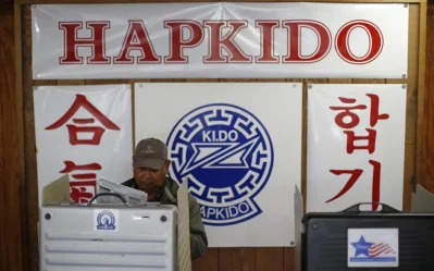 A voter looks over his ballot at a martial arts school used as a polling station in Chicago. Photo: Jim Young