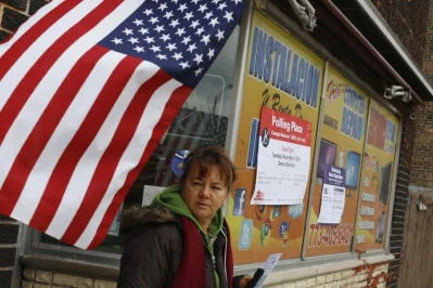 A voter leaves a computer repair shop being used a polling station in Chicago. Photo: Jim Young