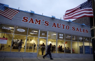 A voter leaves a car dealership being used as a polling station in Chicago. Photo: Jim Young