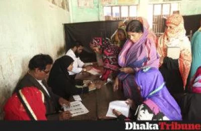 Election officers collect the voter ballots PHOTO- RAJIB DHAR/DHAKA TRIBUNE