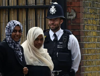 A police officer stands on duty outside a polling station in Tower Hamlets, London, Britain June 8, 2017rnREUTERS