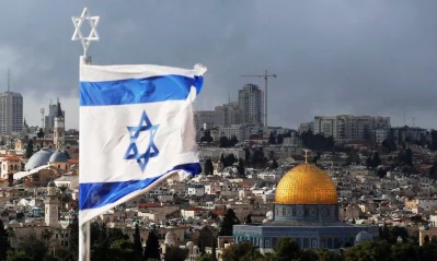 An Israeli flag is seen near the Dome of the Rock, located in Jerusalems Old City on the compound known to Muslims as Noble Sanctuary and to Jews as Temple Mount December 6, 2017 (REUTERS)