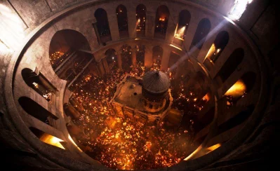 Worshippers hold candles as they take part in the Christian Orthodox Holy Fire ceremony at the Church of the Holy Sepulchre in Jerusalems Old city April 14, 2012 (REUTERS)