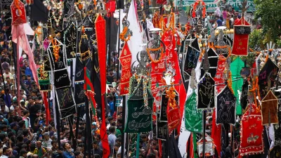 People carry flags and banners with Islamic inscriptions in the procession | Mehedi Hasan/Dhaka Tribune