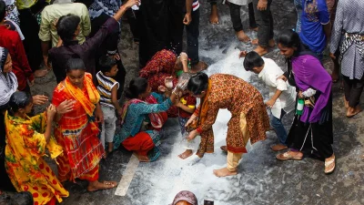 One of the rituals includes washing the horseu2019s legs in milk, which is later collected by mothers and elders as a blessing for their children | Mehedi Hasan/Dhaka Tribune