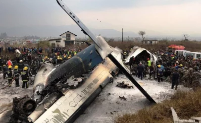 Wreckage of an airplane is pictured as rescue workers operate at Kathmandu airport, Nepal March 12, 2018rnReuters
