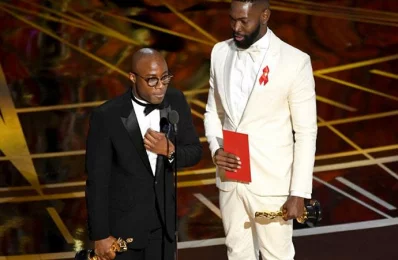 Writer/director Barry Jenkins (L) and writer Tarell Alvin McCraney accept Best Adapted Screenplay for Moonlight onstage during the 89th Annual Academy Awards at Hollywood &amp; Highland Centre on February 26, 2017 in Hollywood, California/AFP