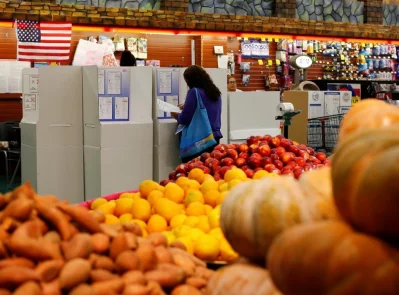 A woman votes in the primary election at a polling station located in a grocery store, in National City, California. Photo: Mike Blake