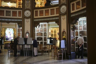 Voters cast ballots at a polling place in the Neptune Societys Columbarium in San Francisco. Photo: Robert Galbraith