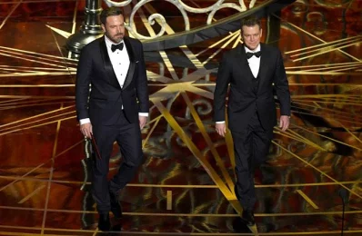 Actor/director Ben Affleck (L) and actor/producer Matt Damon walk onstage during the 89th Annual Academy Awards at Hollywood &amp; Highland Centre on February 26, 2017 in Hollywood, California/AFP