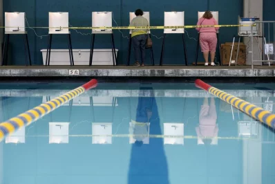 People fill out their ballots at a polling place at a swimming pool in Los Angeles. Photo: Lucy Nicholson