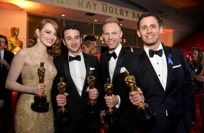  (L-R) Actor Emma Stone, winner of the award for Actress in a Leading Role for La La Land, and composers Justin Hurwitz, Justin Paul and Benj Pasek, winners of the award for Music (Original Song) for City of Stars from La La Land, attend the 89th Annual Academy Awards Governors Ball at Hollywood &amp; Highland Centre on February 26, 2017 in Hollywood, California/AFP