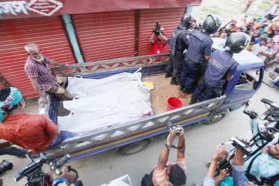 The bodies of the killed militants are taken away in a police truck 