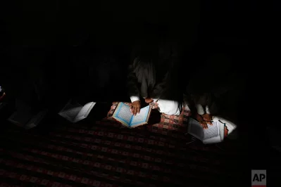 Indian Muslim children read the holy Quran at a Mosque in Allahabad, Uttar Pradesh state, India, Tuesday, March 28, 2017. Uttar Pradesh, with a population of 204 million, is Indias most populous staternrnAP