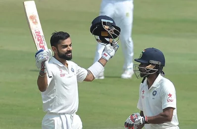 Indias captain Virat Kohli raises his bat for his double century (200 runs)  on the second day of the Test cricket match between India and Bangladesh in Hyderabad on February 10, 2017/AFP Photo