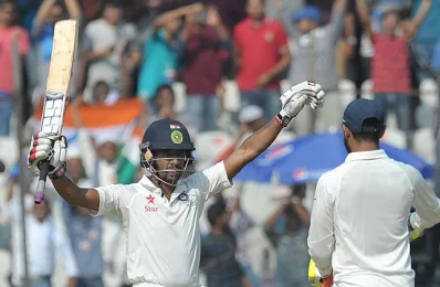 Indias Wriddhiman Saha celebrates after scoring century (100 runs) on the second day of the solo Test match between India and Bangladesh in Hyderabad on February 10, 2017/AFP Photo