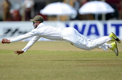 Bangladesh cricketer Shakib Al Hasan dives as he attempts to field a ball hit by Sri Lankan cricketer Upul Tharanga during the fourth day of their opening Test match between Sri Lanka and Bangladesh in Galle on March 10, 2017/AFP PHOTO