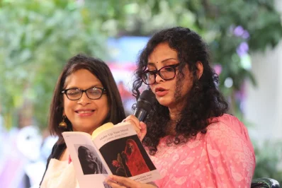 Childrens author, child-rights activist, and actress Nandana Sen reads from a book as social activist and actress Sara Zaker looks on | Syed Zakir Hossain/Dhaka Tribune