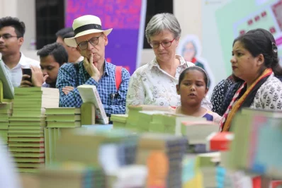 Readers of different ages alike look intently at the mountain of books before | Syed Zakir Hossain/Dhaka Tribune