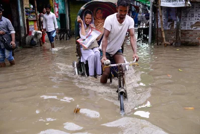 Some tried riding on rickshaws to avoid getting their feet wet, but to no avail | Mahmud Hossain Opu/Dhaka Tribune