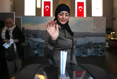 A woman wearing an Islamic headscarf, votes in the general elections in a mosque in Amsterdam, NetherlandsrnrnREUTERS