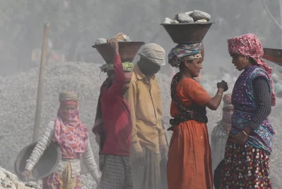 Some workers seen finding the lighter side to working in such an unhealthy work environment | Syed Zakir Hossain/Dhaka Tribune