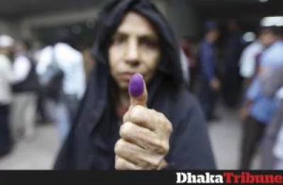 A woman proudly displays her ink-stained thumb  PHOTO - MAHMUD HOSSAIN OPU/DHAKA TRIBUNE