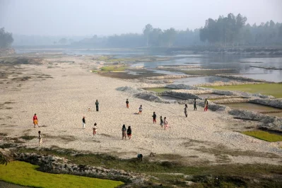 Children play on a shoal of Karatoya River in Panchagarh