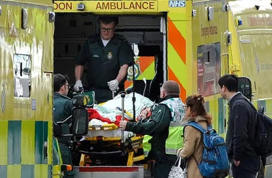 Paramedics load a victim into the back of an ambulance as members of the emergency services work on Westminster Bridge, alonside the Houses of Parliament in central London on March 22, 2017, during an emergency incident AFP