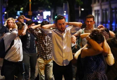 People leave the area with their hands up after an incident near London Bridge in London, Britain June 3, 2017/REUTERSrn