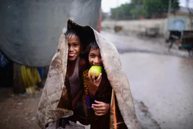 Children play in the rain with all smiles  | Mahmud Hossain Opu