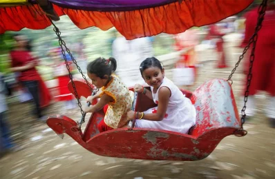 Children on a carousel at a fair on Pohela Boishakh. Photo taken at Ramna on April 14, 2018 | Mehedi Hasan/Dhaka Tribune