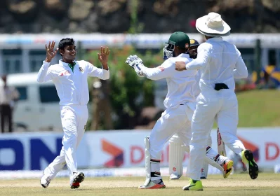Bangladesh cricketer Mehedi Hasan (L) celebrates the wicket of Sri Lankan cricketer Dimuth Karunaratne with teammates on the first day of the opening Test match between Sri Lanka and Bangladesh at the Galle International Cricket Stadium in Galle on March 7, 2017  AFP 