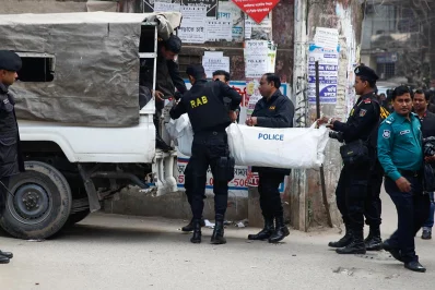 The body of one of the militants is removed from the hideout in Dhakas Nakhalpara on Friday, January 12, 2018 | Mehedi Hasan/Dhaka Tribune