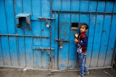 A boy stands near the main gate of the orphanage in Dhaka | Mahmud Hossain Opu/Dhaka Tribune