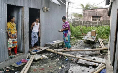 Locals walk on wooden planks as sewerage lines remain underdeveloped | Focus Bangla