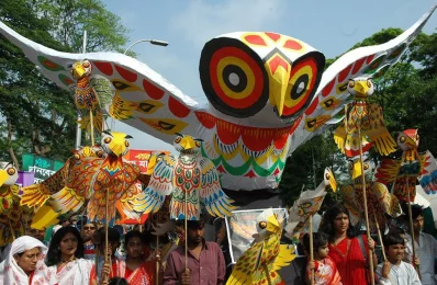 Props of owl including a large coloured one attract the people in the annual Mongol Shobhajatra procession on the Dhaka University campus welcoming Pohela Boishakh in 2005