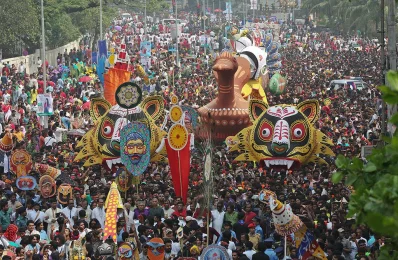 Festoons of colourful masks, giant tigers and peacocks steal the show in Dhaka University welcoming Pohela Boishakh 2014