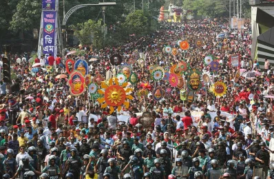 Police guarding the Mongol Shobhajatra with sun, king, flowers and the beautiful princess in Dhaka University area while welcoming Pohela Boishakh in 2017
