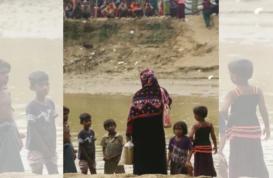 Waiting to meet her family - Fatima, a Rohingya woman who works at a garments factory in Dhakau2019s Mirpur area, waits at the Tumru border in Bandarban with food for her family, who are about to enter Bangladesh from Myanmar. The photo was taken on September 7, 2017 | Syed Zakir Hossain/Dhaka Tribune