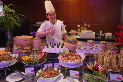 Guest Chef Tan Kwang Aik from the JW Marriott Hotel Kolkata poses with some of the many dishes on offer at the Westin Dhaka on the occasion of Chinese Food Festival 2017. SYED ZAKIR HOSSAIN/DHAKA TRIBUNE