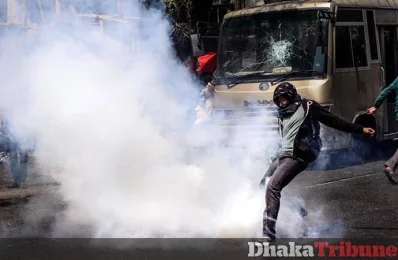 Protestor seen kicking back a tear gas grenade thrust at them to disperse the crowd MAHMUD HOSSAIN OPU/DHAKA TRIBUNE