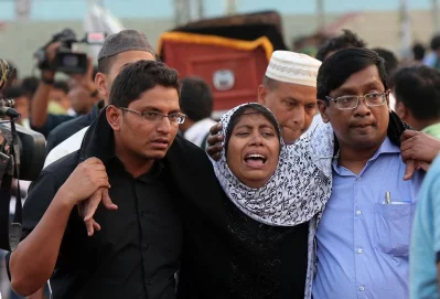 Some in attendance at the janaza were too stricken by grief at the sight of their lost loved ones to stay on their feet | Syed Zakir Hossain/Dhaka Tribune