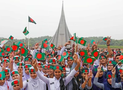 Students from different educational institutions with miniature national flag at National Memorial in Savar | Dhaka Tribune