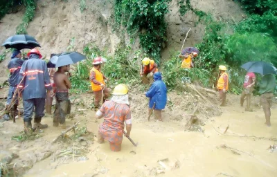 The rescue mission  - Bangladeshi firefighters search for bodies after a landslide in Bandarban on Tuesday. Heavy monsoon rains have killed at least 129 people in three districts, most of them buried under landslides/DHAKA TRIBUNE