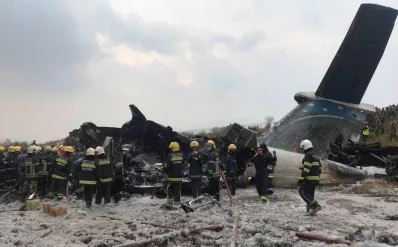Wreckage of an airplane is pictured as rescue workers operate at Kathmandu airport, Nepal March 12, 2018  Reuters